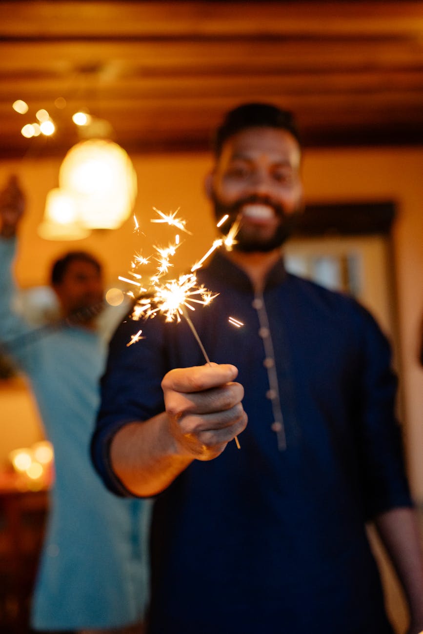 man holding a sparkler